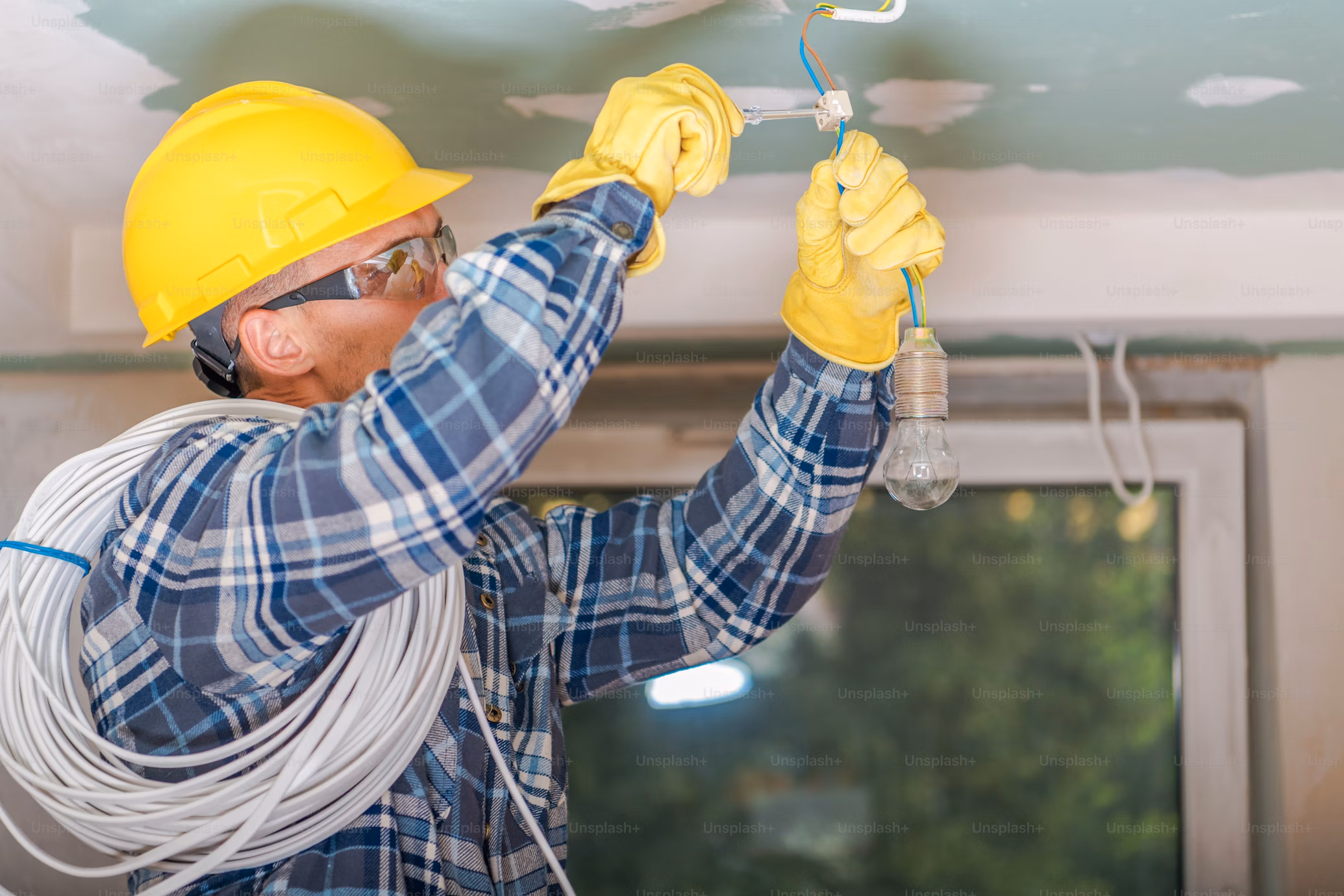 Professional electrician working on electrical panel - Hometown Electrical Services licensed electricians in Ottawa